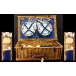 A Wicker Picnic Hamper with four place s