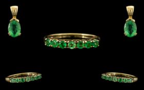 9 ct Yellow Gold Siberian Emerald 7 Stone Eternity Ring - Stone weight 0.387 cts. Together with a