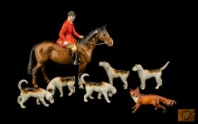 Beswick Hunting Set to include the mounted hunstman Model 1501, five hounds and fox. The huntsman