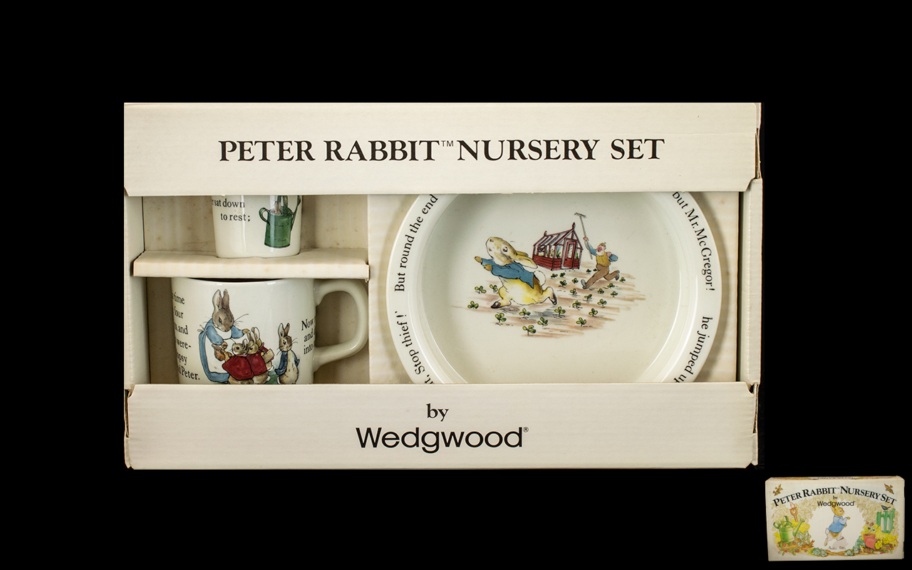 Peter Rabbit Nursery Set by Wedgwood comprising a bowl, egg cup and mug, all in original box with
