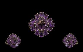 Amethyst Cluster Ring, a square cut amethyst of 2cts, set on the diagonal, with three pear cut