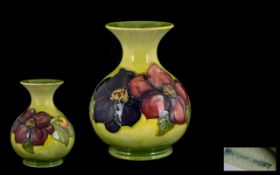 Moorcroft Tubelined Globular Shaped Vase 'Clematis and Berries' design on yellow ground, circa