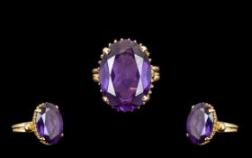 14ct Gold - Superb Quality Single Stone Amethyst Set Dress Ring. Marked 585, The Large Oval Shaped