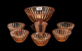 A Glass Art Deco Dessert Set comprising of a bowl and 5 dishes. Together with a cream jug.