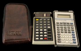 Two Calculators - one Novus Mathematician calculator with case, and one Texas Instruments