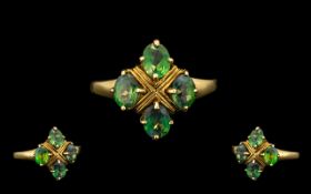 A Ladies 9ct Gold Russian Alexandrine Attractive Set Cluster Ring. The Four Oval Mixed Cut Medium