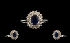 18ct White Gold - Attractive Sapphire and Diamond Set Dress Ring, Flower head Design. The Diamonds