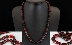 Cherry Amber/Bakelite Necklace. Early 20th century necklace with yellow metal clasp, length 24