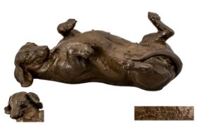 Doris Lindner Bronze-Effect Model Dachshund lying on its back, Length 10.5 inches.