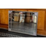 A Large Contemporary Over Mantle Mirror . With chrome coloured frame and panelled edges with