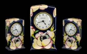 Moorcroft Modern Tube lined Table Clock Paradise Flower Pattern. Designer Emma Bossons. Date 2003.