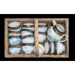 1950s wicker basket with a quantity of Japanese Porcelain comprising cups & teapot, with blue and