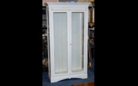 A Limed Oak French Style Glass Free Standing Display Cabinet with two glazed doors and with glazed