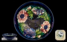 William Moorcroft Signed Footed Bowl of Large Proportions ' Anemone ' Pattern on Blue Ground. Signed