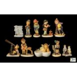 Collection of Hummel Figures seven (7) in total, including two figures playing musical