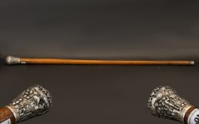 A North American Walking Stick with a possibly Silver Engraved Top, looks silver. Handle of large