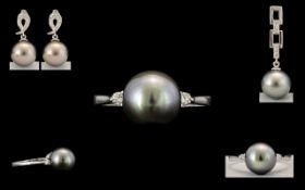 9ct Tahitian Pearl & SI Diamond Ring - Round Tahitian Pearl 9 mm, weight 4.300 cts, Diamond weight