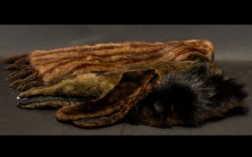 Collection of Fur Items to include a fur stole in mink with tail fringing; a small dark brown fur