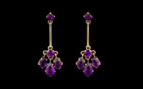 Antique Period Pair of Attractive 9ct Gold Amethyst Set Drop Earrings in a Flower head Design. The