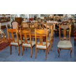 A Set of Eight Dining Chairs with green upholstered seat and head rest. With splayed lays and