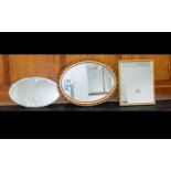 A Collection of Four Framed Mirrors, including two gilt and one 1950's mirror with bevelled glass.