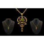 Art Nouveau 15ct Gold Peridot Ruby and Seed Pearl Pendant of Wonderful Form In The Suffragette