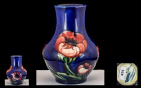 William Moorcroft Signed Bulbous Shaped Vase ' Big Poppy ' Design of Blue Ground. Signed to