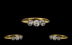 18ct Gold and Platinum 3 Stone Diamond Set Ring. Marked 18ct and Platinum, The 3 Cushion Cut