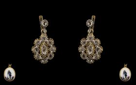 A Pair of Antique Portuguese Diamond Earrings rose cut diamonds in a stylised flower drop for
