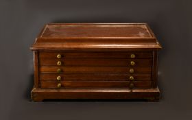 Coin Cabinet. Coin cabinet with 5 draws to house coins, brass handles to side, made of solid wood