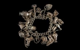 1950's / 1960's Silver Bracelet Loaded with 20 Sterling Silver Nice Quality Charms of Various