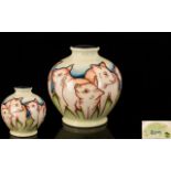 Moorcroft - Modern Tubelined Golbual Shaped Vase - decorated in pastel shades.