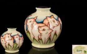 Moorcroft - Modern Tubelined Golbual Shaped Vase - decorated in pastel shades.