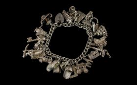 Silver Curb Bracelet Loaded with 23 Silver Charms. All Marked for Silver. Interesting Charms. All In