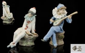 Nao by Lladro Pair of Figures comprising 1. Harlequin strumming a mandolin. Height 7.5 inches 18.