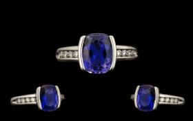 18ct White Gold - Quality Tanzanite and Diamond Set Dress Ring of Pleasing Design. The Tanzanite