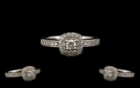 18ct White Gold Attractive and Nice Quality Diamond Set Dress Ring with a Flower head Design. The