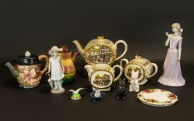 A Mixed Lot of Pottery to include a Royal Albert Kettle Stand, a Beswick character teapot, a Torquay