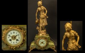 A French Figural Spelter Mantle Clock a pheasant girl at the fountain surmounted on a green onyx