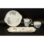 Collection of Shelley Vintage 'Blue Iris' Porcelain comprising a milk jug, sugar bowl and cake