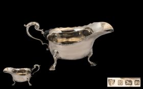 A Solid Silver Sauce Boat with Shaped Bo
