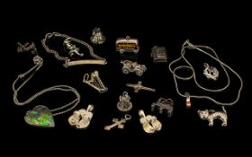 Collection Of Silver Jewelry. To include varies silver charms, silver necklaces, silver I D