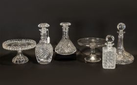 Collection of Four Decorative Cut Glass Decanters comprising one square, one bell shaped, one oval