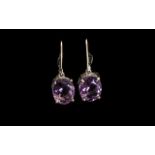 Amethyst Solitaire Drop Earrings, oval cut solitaires of dark purple amethyst, totalling 6.5cts, set