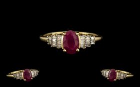 Ladies 9ct Gold Contemporary Ruby and Diamond Set Dress Ring marked 9.375. The central oval shaped