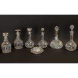 Collection of Six Cut Glass Decanters comprising two matching decanters with a diamond cut design;