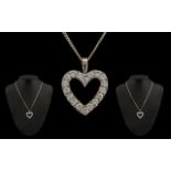 18ct White Gold Impressive Diamond Set Heart Shaped Pendant with attached 18 ct white gold chain.