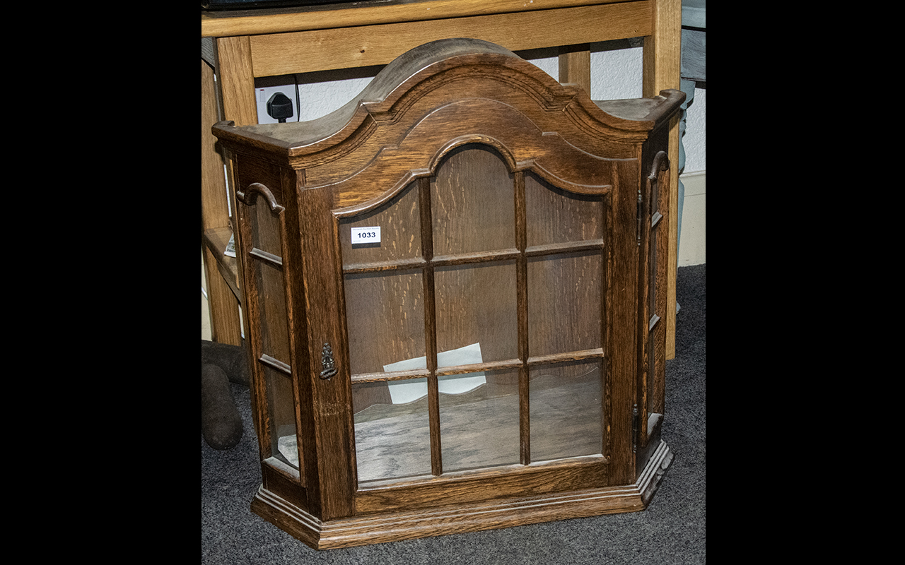 Oak Wall Mounted Bow Front Display Cabinet with glass front and three interior shelves. Arched top