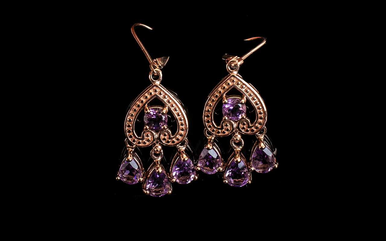 Rose de France Amethyst Triple Drop Pendant Earrings, each stylish earring comprising three pear cut