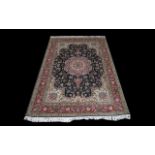 A Persian Isfahan Carpet of Extremely fine quality, close knotted weave, the central panel and